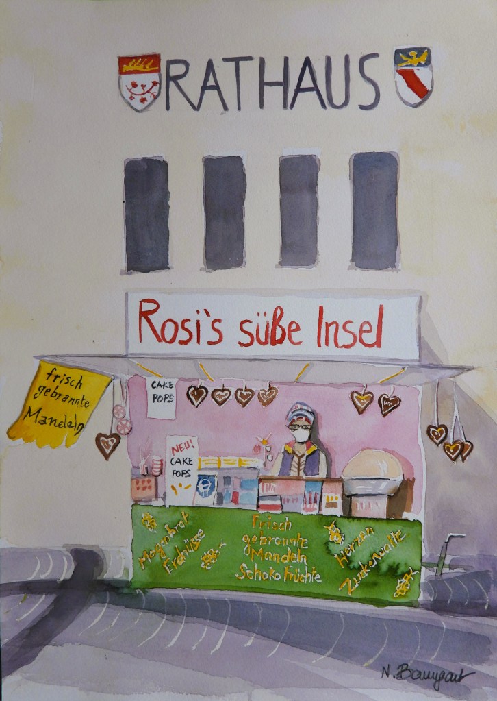 Marktstand mit dem Namen 'Rosi's süße Insel', der frische gebrannte Mandeln und Cake Pops anbietet, vor dem Rathaus.